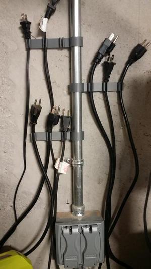Power cable holder for conduit based wiring
