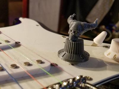 guitar knob goes to 11 with demon skull