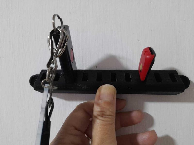 Wall mounted USB flash drive holder