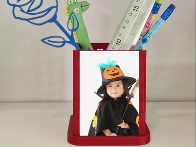 Pen holder with photo frame