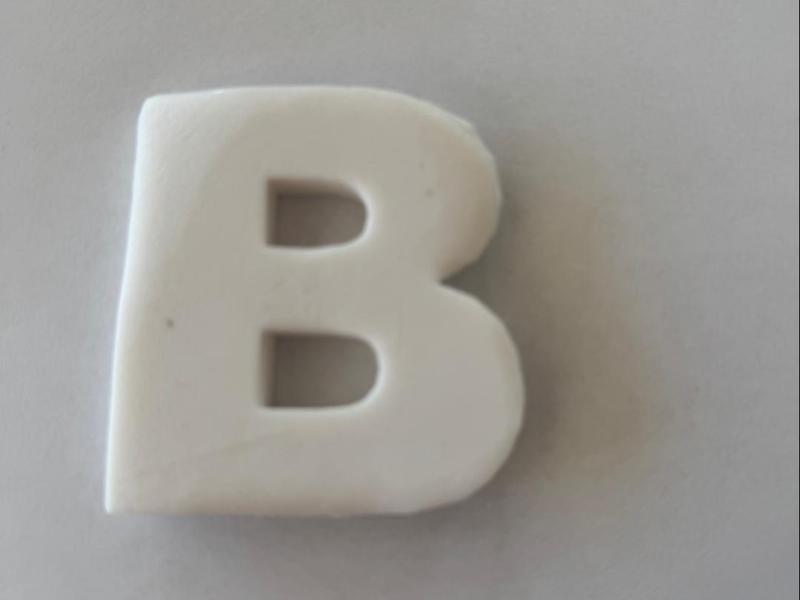 Cookie cutter in the form of a B read description 