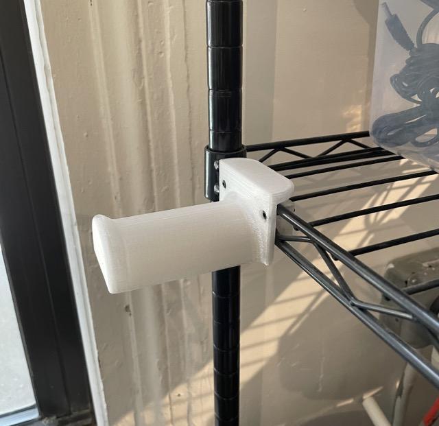 Filament hanger for wire style shelf
