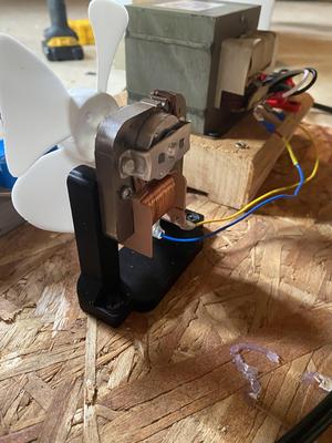 Microwave oven fan mount