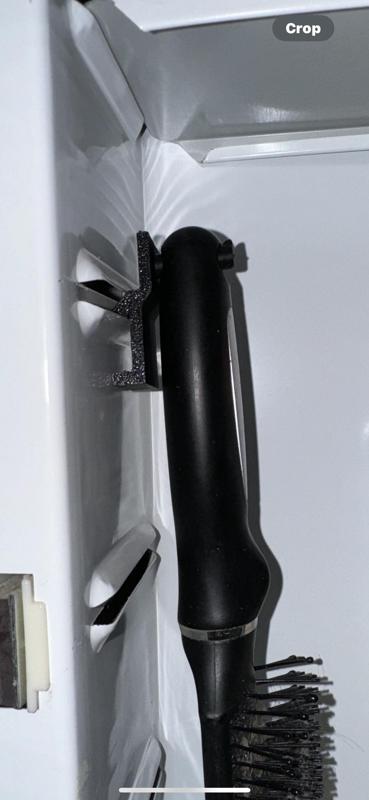 Medicine cabinet hairbrush hanger
