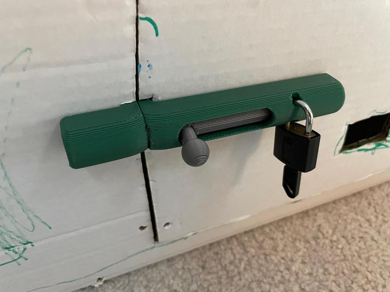 Sliding lock for cardboard box playhouse