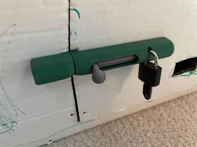 Sliding lock for cardboard box playhouse