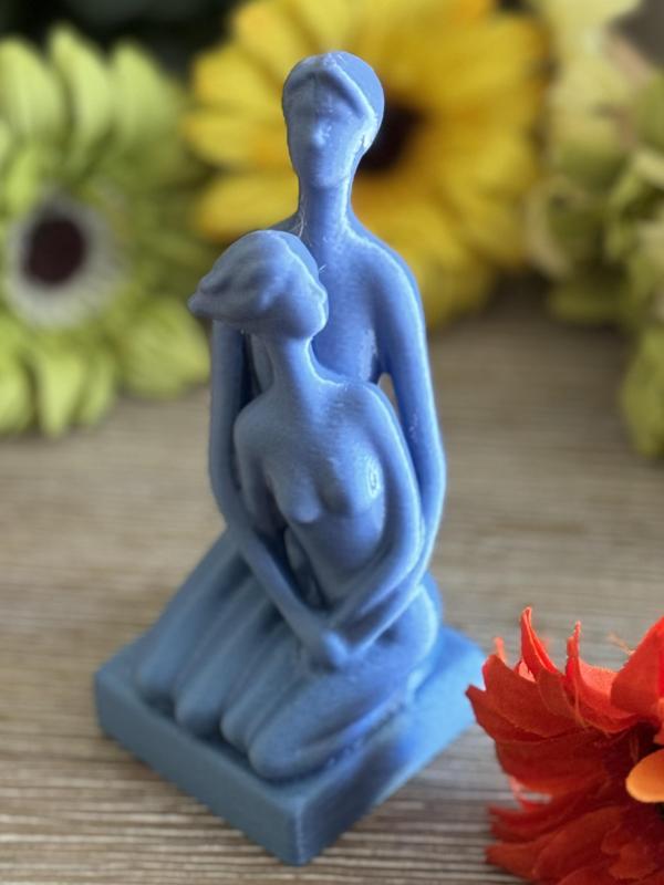 Man and Woman Embracing Figure
