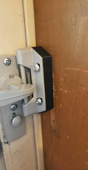 Screen door latch spacer