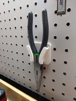 Peg board plier holder