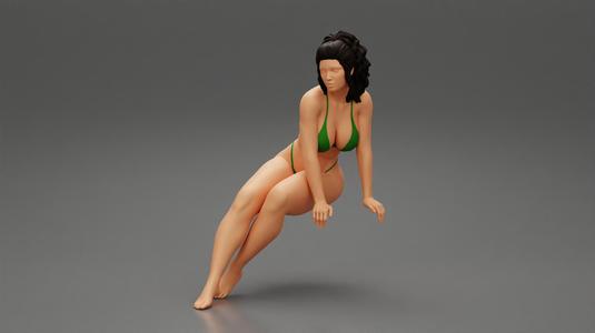 Girl with Dark Hair in Elegant Bikini Relaxing on Summer Beach