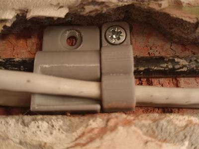 Cable holder with screw-hole