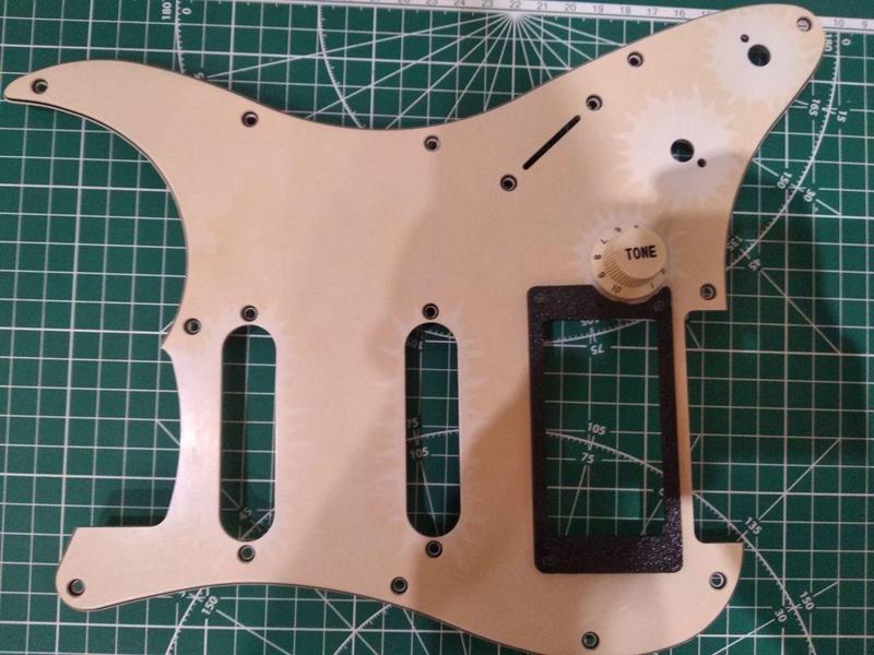 Stratocaster humbucker frame. With cutout for volume knob
