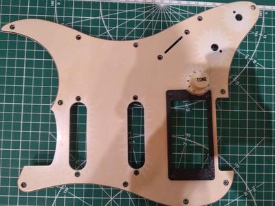 Stratocaster humbucker frame. With cutout for volume knob