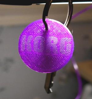 Korg circle shaped keychain