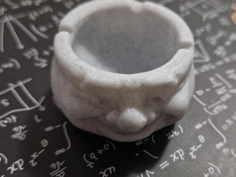 Stone ashtray or trinket dish with a face