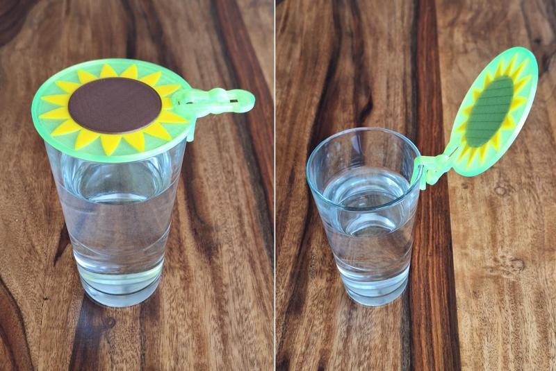 Drinking glass hinged lid