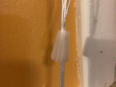 Curtain/Blinds string holder