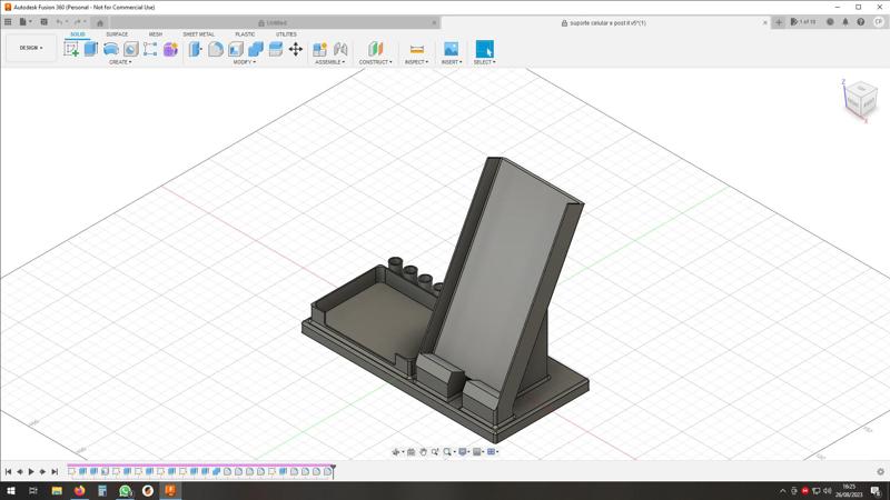 a smartphone, pencil and post it holder
