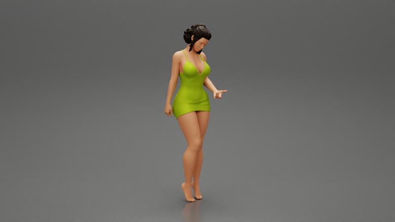 Sexy Girl standing in mini dress on the beach