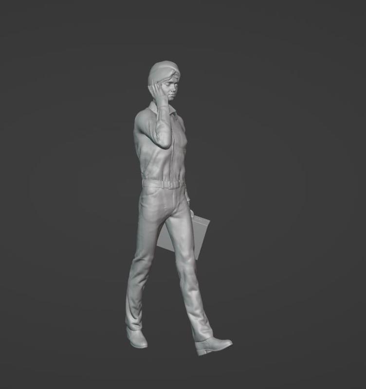walking man with handbag talking on phone