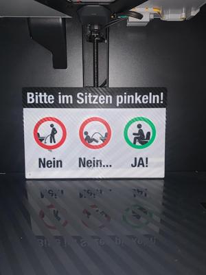 Lustiges Schild: Bitte im Sitzen pinkeln