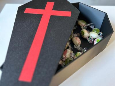 Coffin-shaped candy dispenser