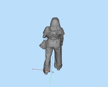 1/12Miniature female figure with one hand in pocket