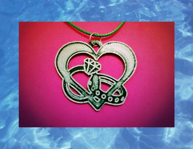 colgante corazon X anillos