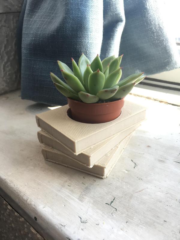Book pile plant pot