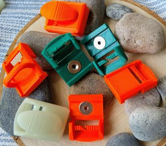 System of multifunctional magnetic buckles (hooks, containers). System wielofunkcyjnych sprzączek (haczyków, pojemników) magnetycznych