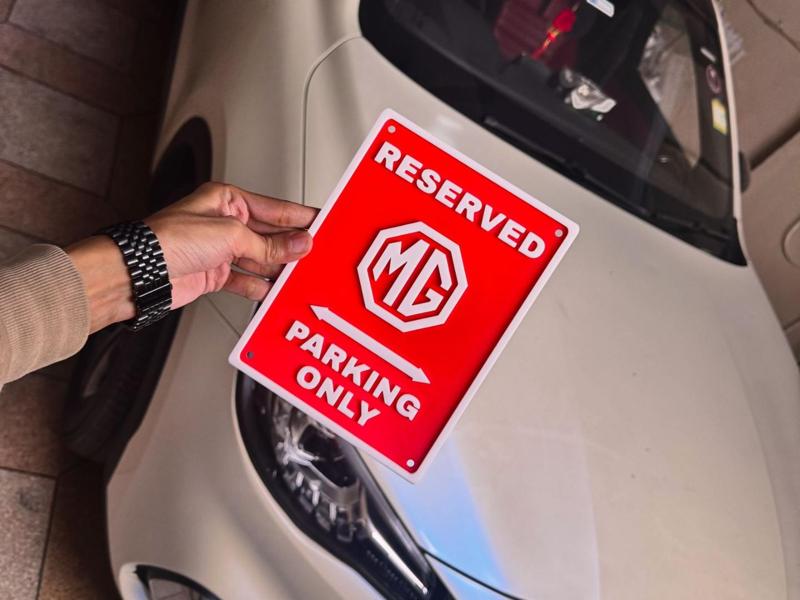 RESERVED MG PARKING ONLY SIGN