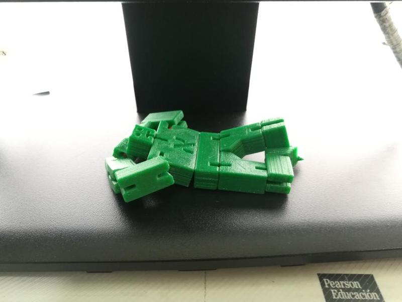 Yossele Tiny. String jointed, block robot puzzle