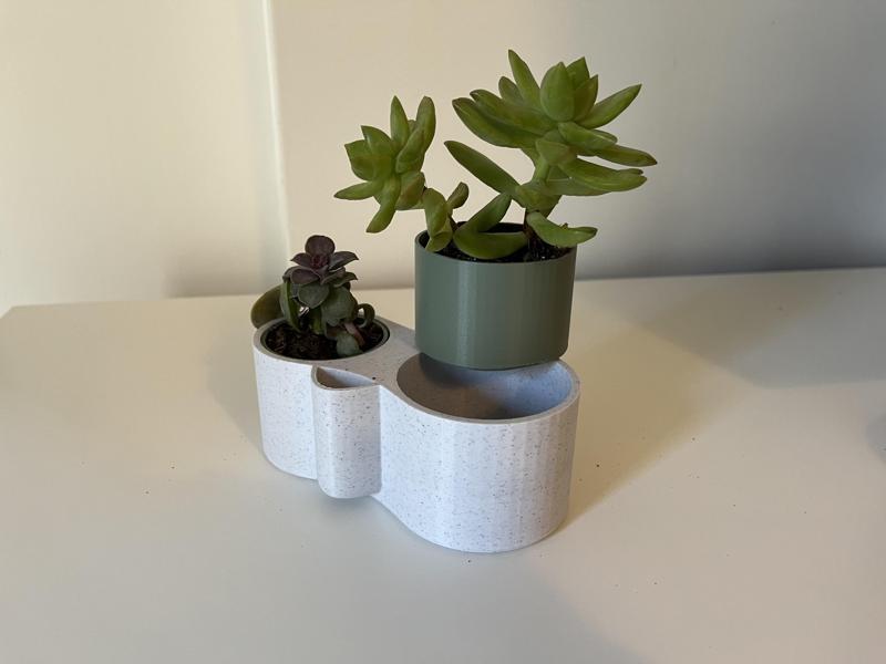 Self-watering planter with drainage system