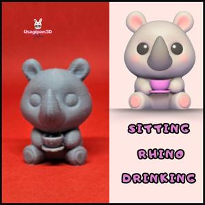 Sitting Rhino Drinking