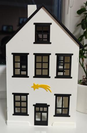 Christmas illuminated house with comet (village)