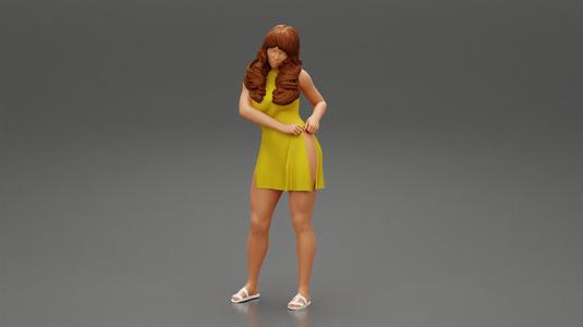 Fashion Girl in Dress with long hair put hands on hip