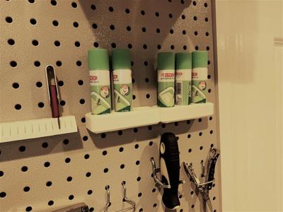 Pegboard holder for glue sticks   