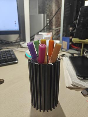 Pencil stand in the shape of a sun