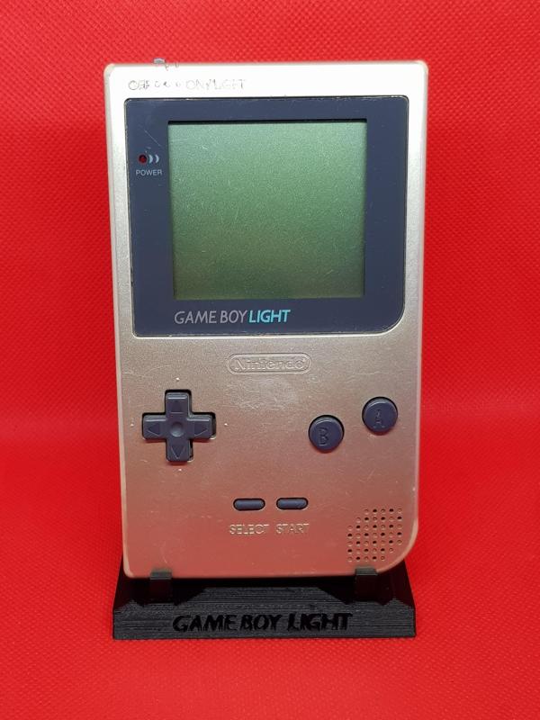 Game Boy Light with hollow words Stand