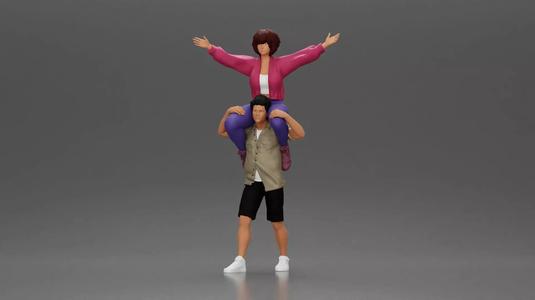 Man in shorts carrying girlfriend on shoulders