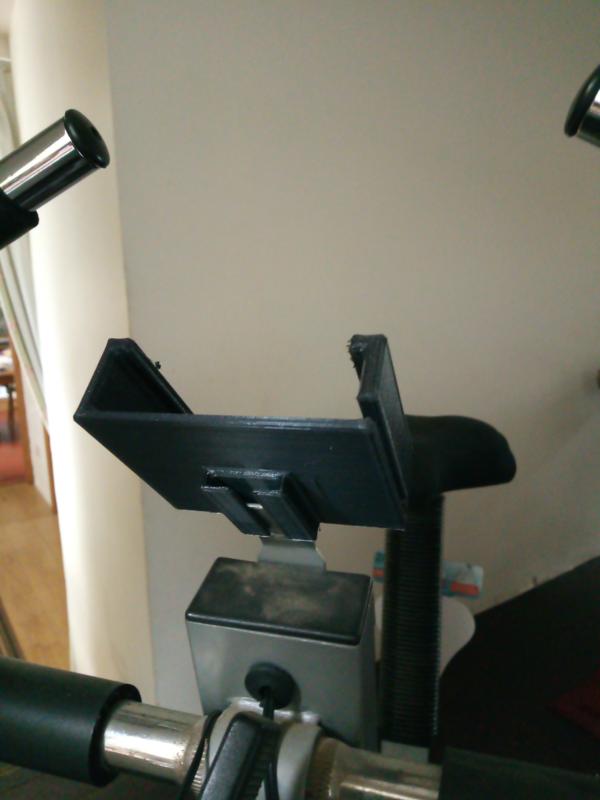 Slotted Mobile phone holder for exercise bike