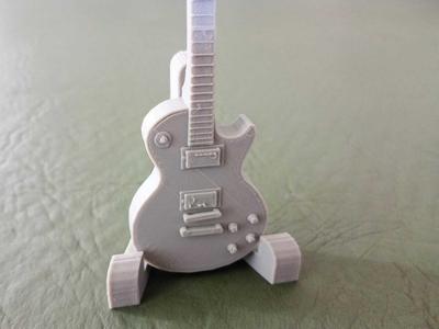 Les Paul guitar with stand.