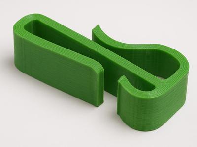 Clip for cargo net on backpack
