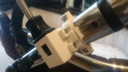 Pram frame clamp and parasol adapter