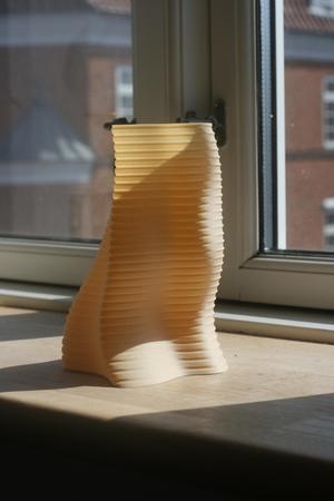 Curved vase with indentations