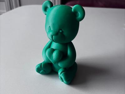 Teddy bear holding a heart