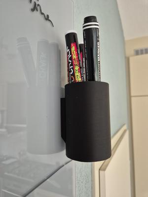 Magnetic pen cup for whiteboard.