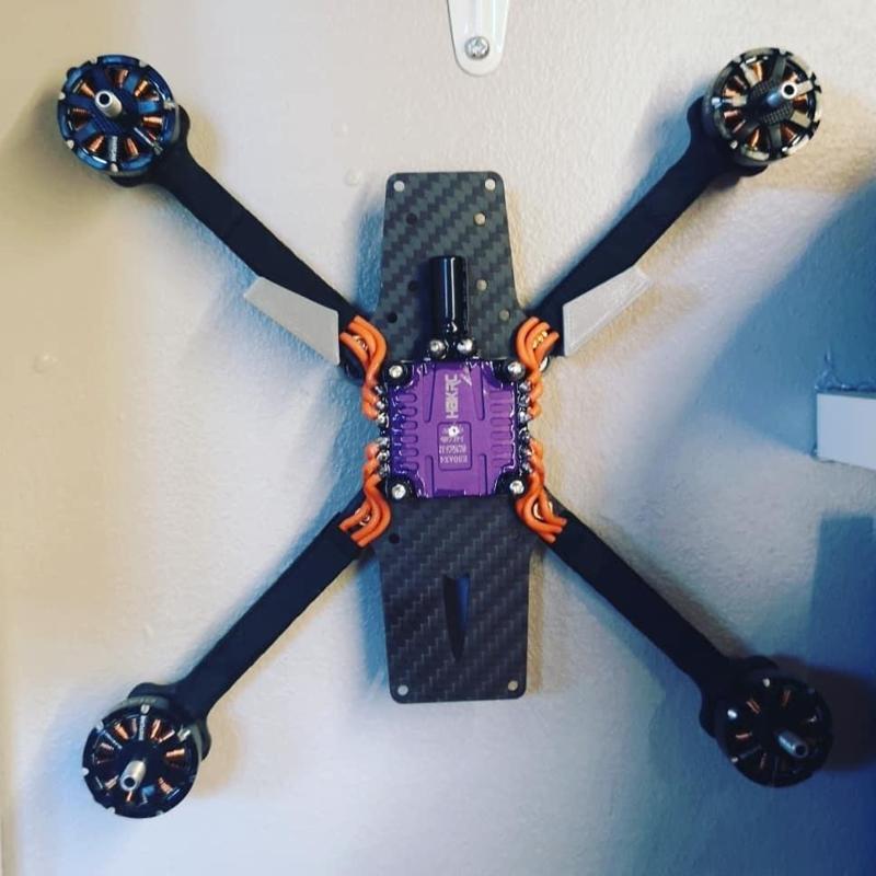 Quadcopter wall hanger