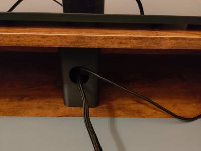 Desk riser with cable hole