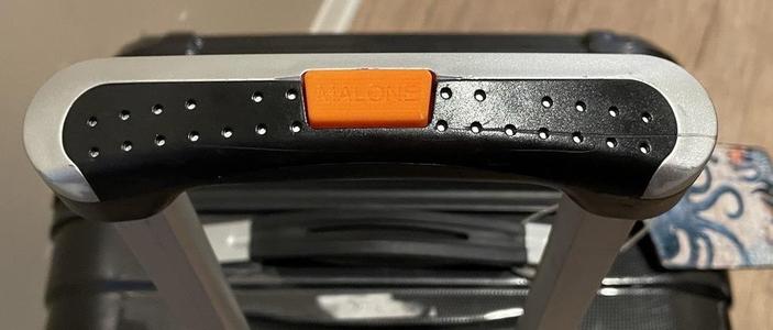 iFLY telescoping handle control button